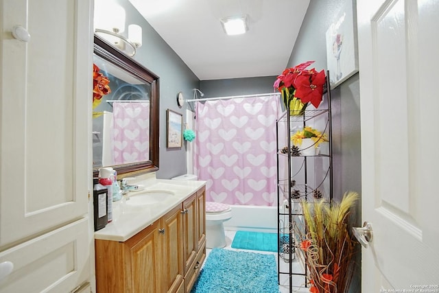 full bathroom featuring vanity, shower / bath combination with curtain, and toilet