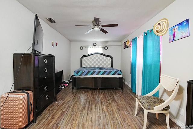 bedroom featuring ceiling fan and hardwood / wood-style floors