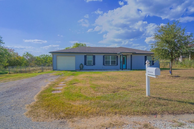 single story home with a garage and a front yard