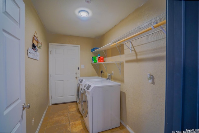 clothes washing area featuring washer and dryer