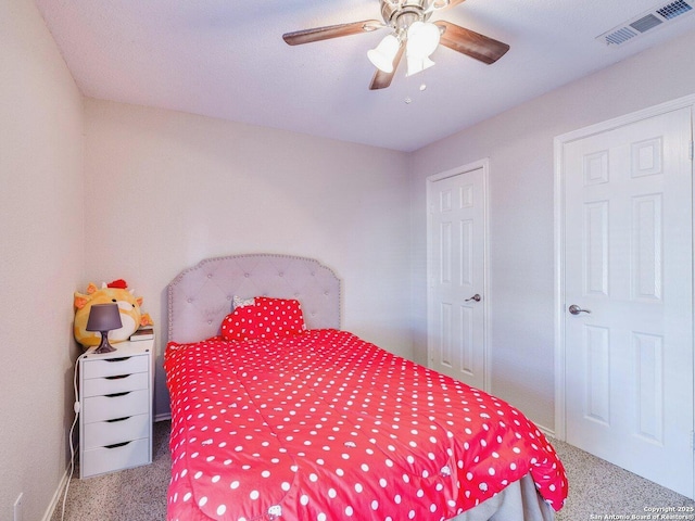 carpeted bedroom featuring ceiling fan