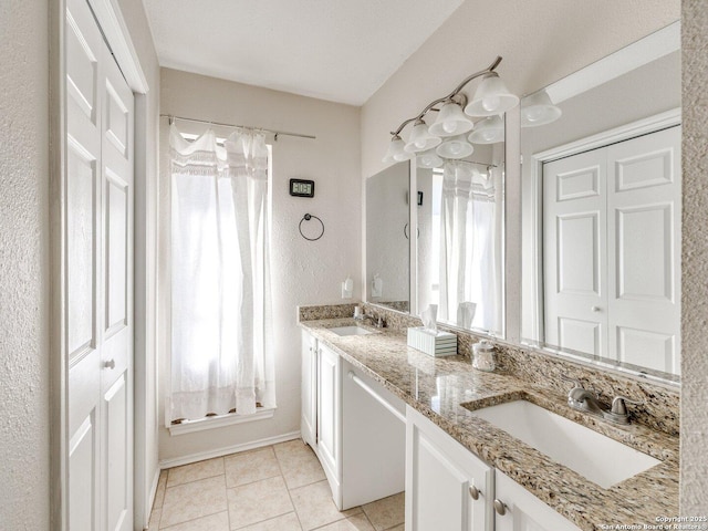 bathroom featuring vanity, tile patterned flooring, and plenty of natural light