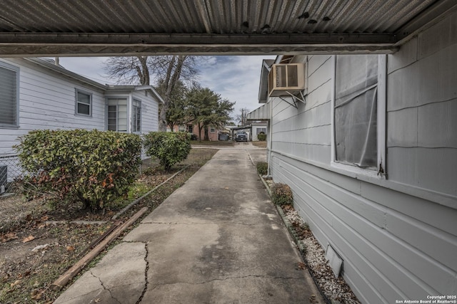 view of side of property with cooling unit