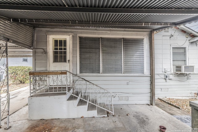 entrance to property featuring cooling unit