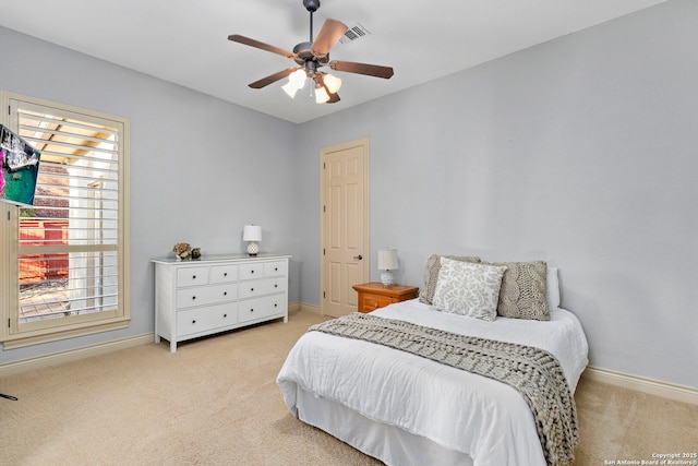 bedroom with light colored carpet and ceiling fan