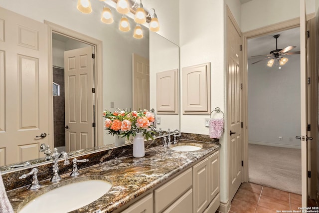 bathroom featuring tile patterned flooring, vanity, and ceiling fan