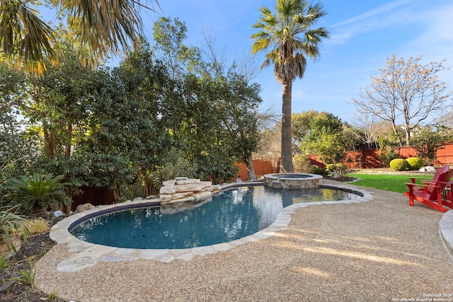 view of swimming pool with a patio and an in ground hot tub