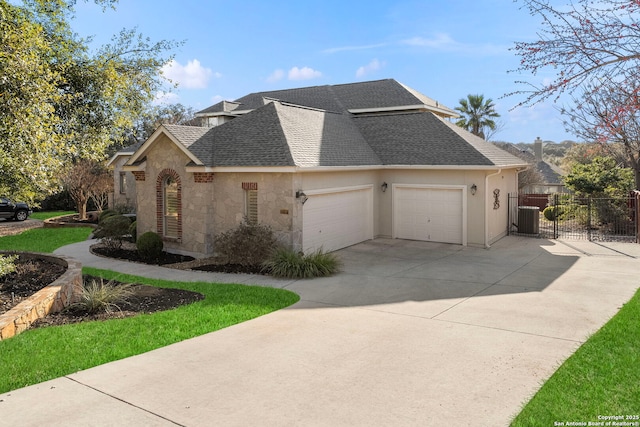 view of home's exterior featuring a garage and central AC