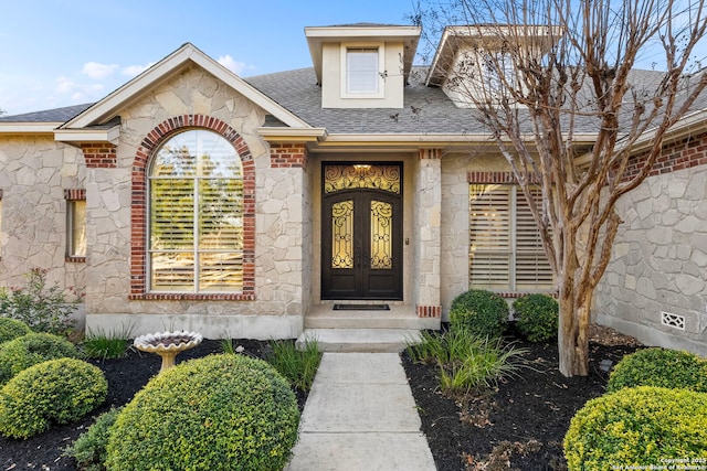 entrance to property featuring french doors