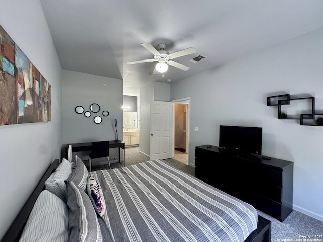 carpeted bedroom featuring ensuite bathroom and ceiling fan