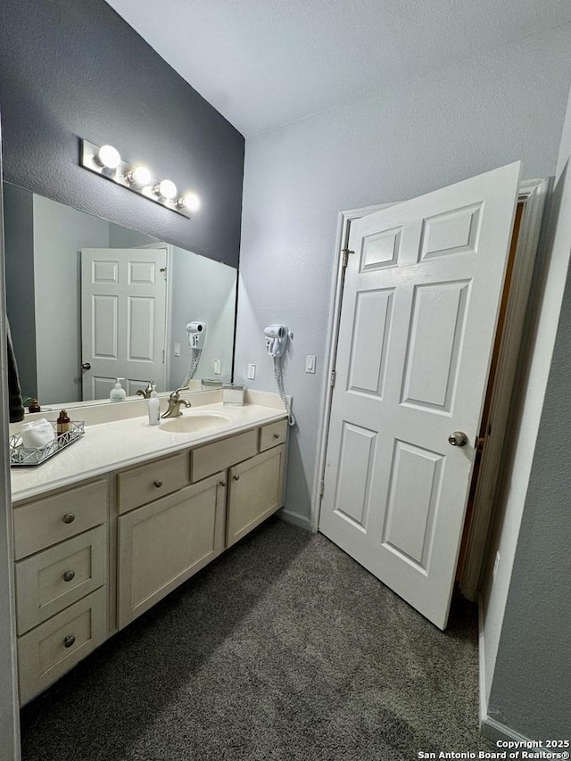 bathroom featuring vanity and a textured ceiling