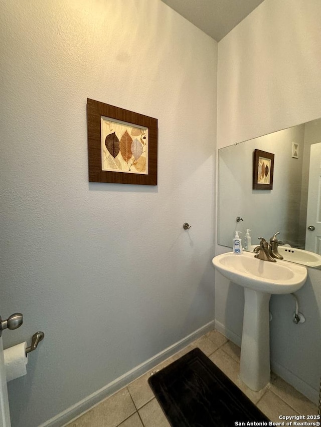 bathroom featuring tile patterned floors and sink