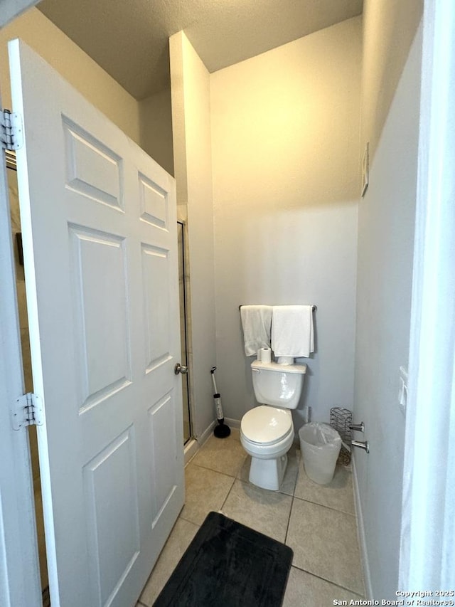 bathroom with tile patterned floors and toilet