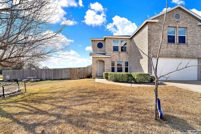 front of property featuring a garage and a front lawn