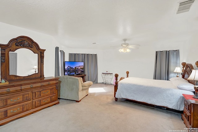 bedroom with light carpet and ceiling fan