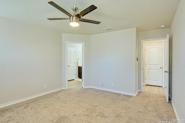 unfurnished bedroom featuring light carpet and ceiling fan