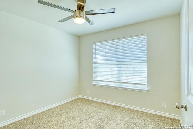 carpeted empty room with ceiling fan