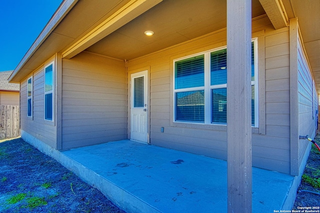 property entrance featuring a patio area