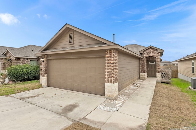 ranch-style house with cooling unit and a garage