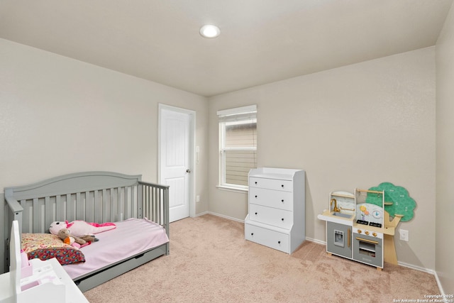 bedroom with light carpet