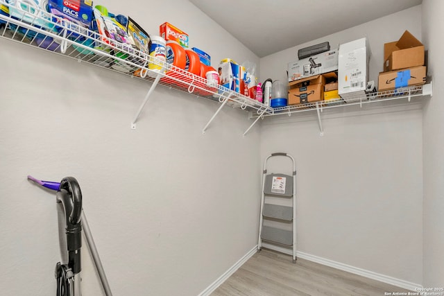 walk in closet featuring light hardwood / wood-style floors