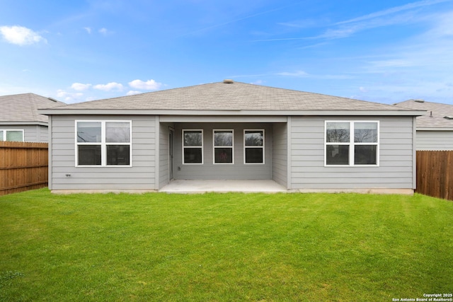 back of house with a lawn and a patio area