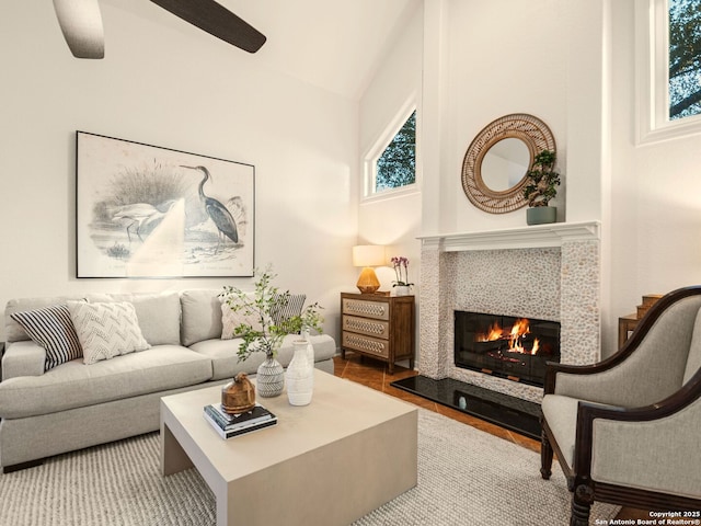 living room with a tile fireplace