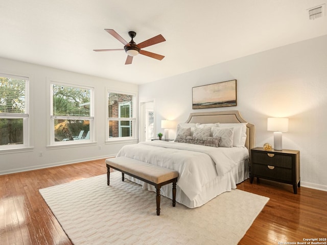 bedroom with hardwood / wood-style flooring and ceiling fan