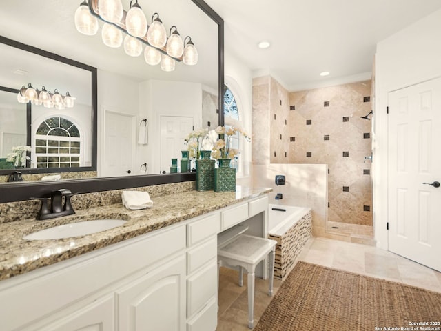 bathroom with vanity, separate shower and tub, and a healthy amount of sunlight