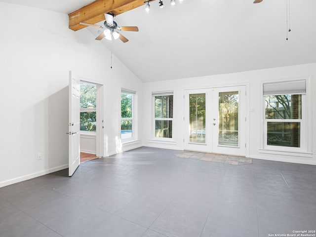 unfurnished living room with french doors, ceiling fan, beam ceiling, and high vaulted ceiling