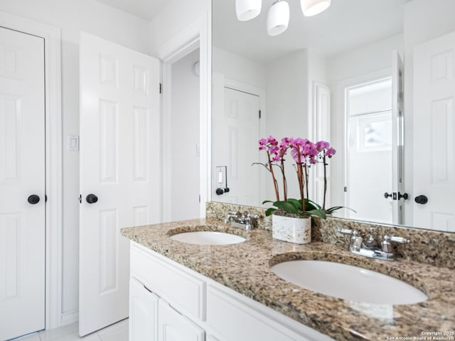 bathroom with tile patterned flooring and vanity