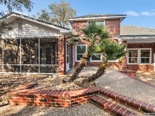 back of property featuring a sunroom