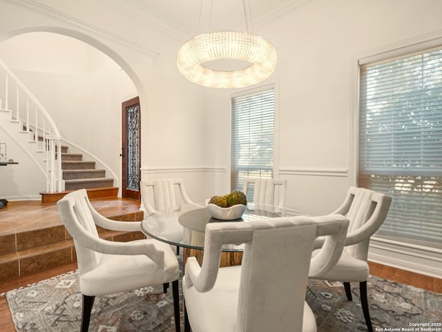 dining room featuring crown molding and hardwood / wood-style flooring