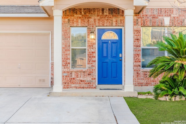 entrance to property featuring a garage