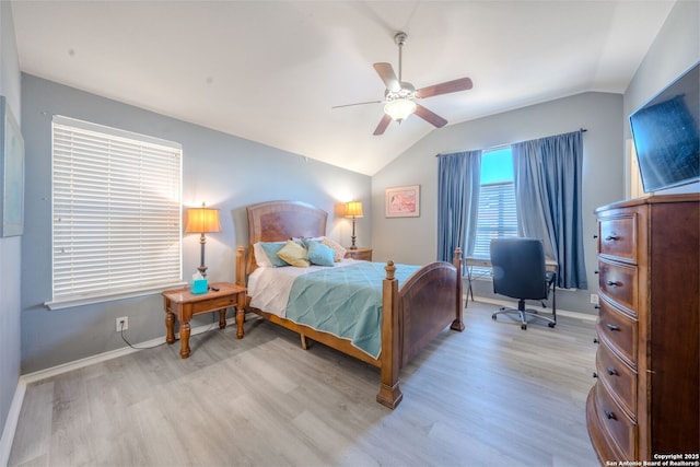 bedroom with lofted ceiling, ceiling fan, and light wood-type flooring