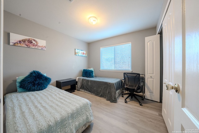 bedroom with light hardwood / wood-style floors