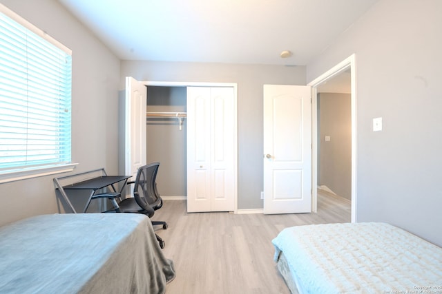 bedroom featuring light hardwood / wood-style floors and a closet