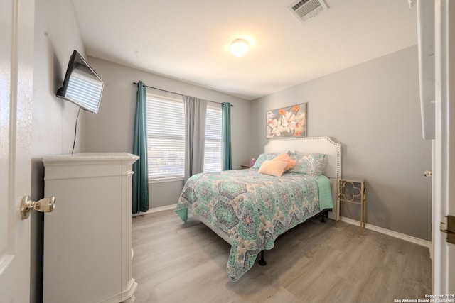 bedroom with light wood-type flooring