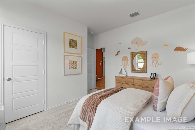 bedroom with light carpet