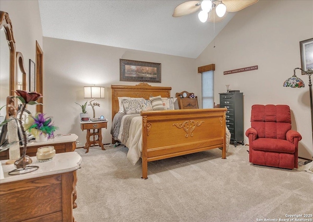 carpeted bedroom featuring vaulted ceiling and ceiling fan