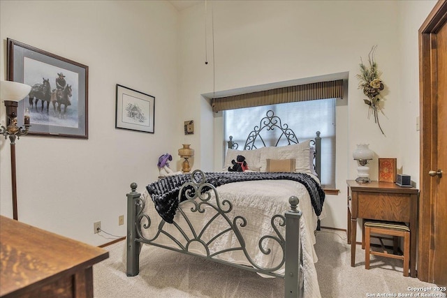 bedroom with light colored carpet