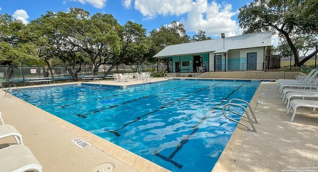 view of swimming pool with a patio