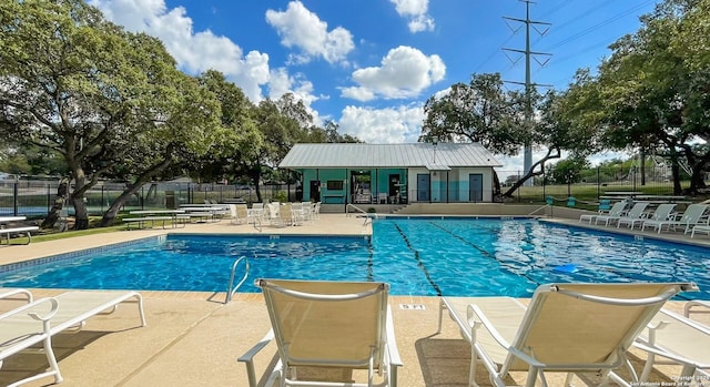 view of swimming pool featuring a patio