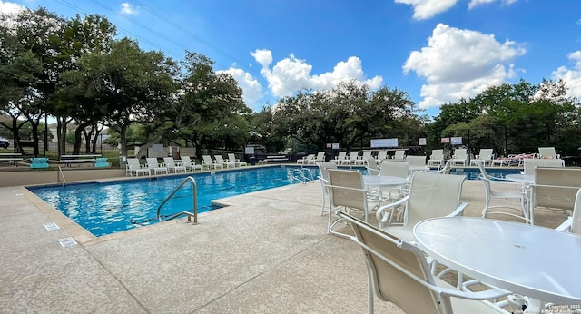 view of swimming pool featuring a patio