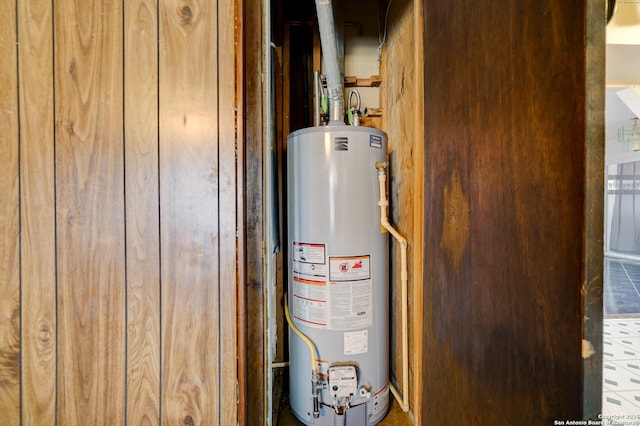 utility room with water heater