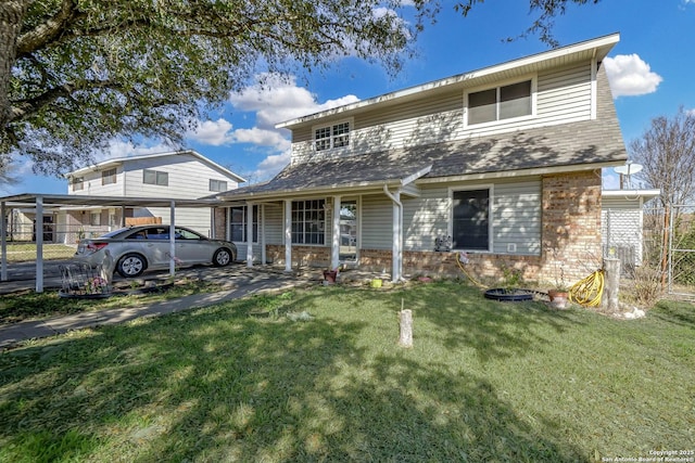 view of front of property with a carport and a front yard