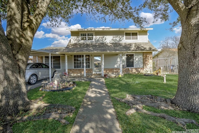 view of front of house featuring a carport and a front yard