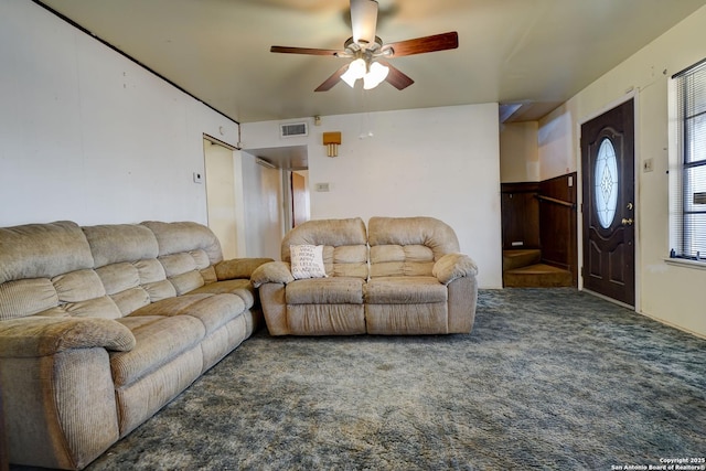 carpeted living room featuring ceiling fan