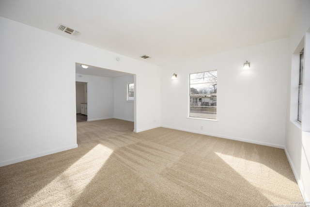 spare room with light colored carpet