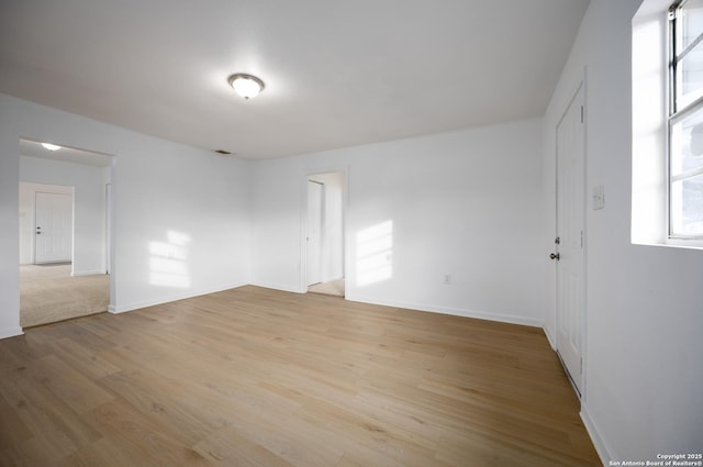 spare room with light wood-type flooring